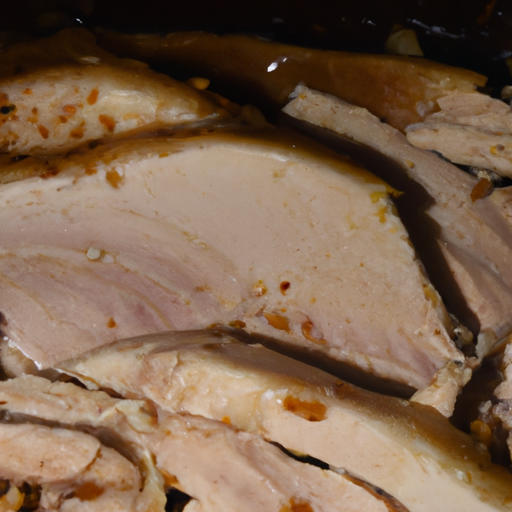 A close-up of carved slices of turkey from a dutch oven, ready to be served.